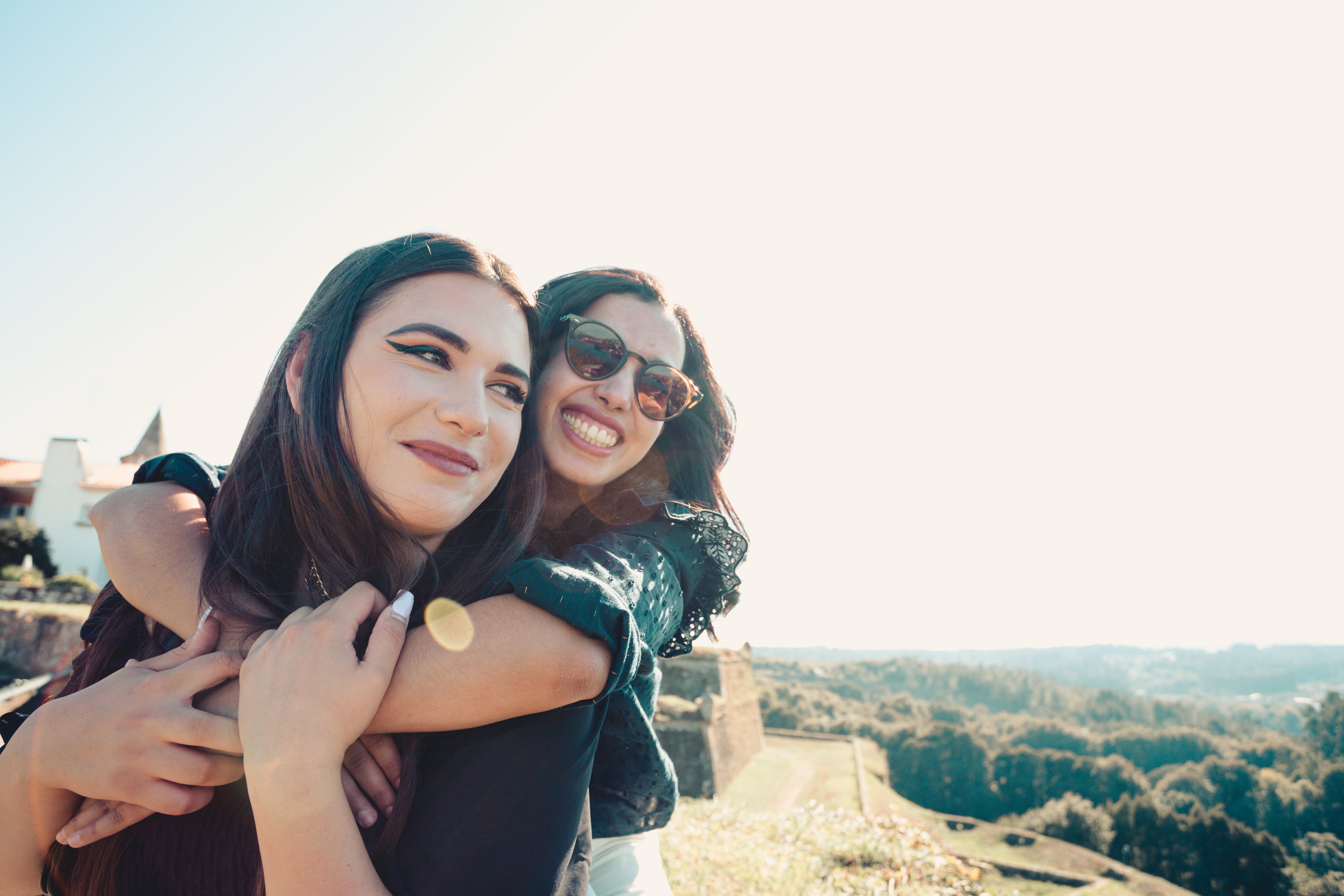 files/woman-hugs-other-woman-from-behind.jpg